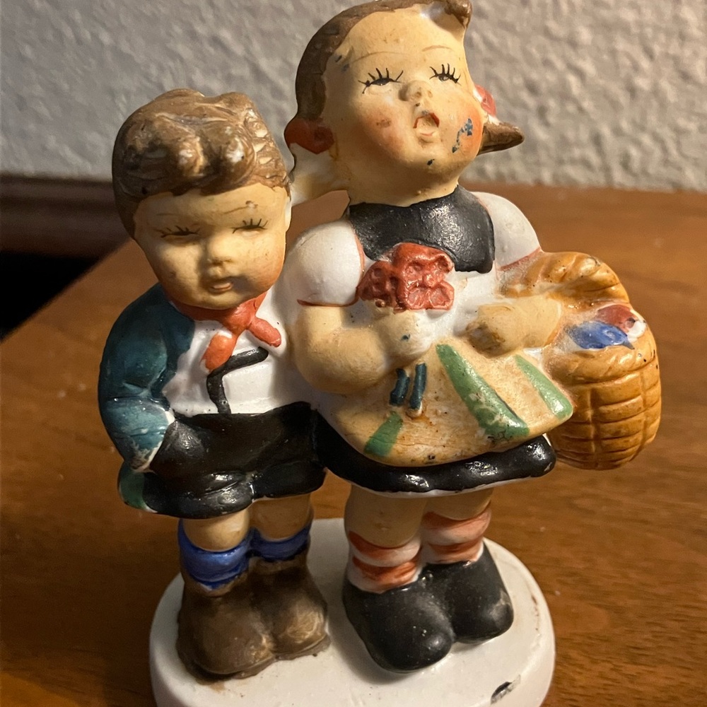 Whimsical Ceramic Figurine with Black and Blue Accents